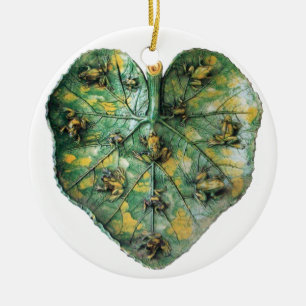 ORNEMENT ROND EN CÉRAMIQUE PETITS CHEVAUX SUR UNE FEUILLE VERTE