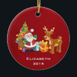 Ornement Rond En Céramique Santa and Reindeer par Christmas Tree with Present<br><div class="desc">Une jolie illustration avec l'esprit de fête. Le Père Noël portant son sac cadeau et saluant. Son ami renne à ses côtés, suspendu par un sapin décoré, avec des cadeaux tout autour. Placez-vous sur un arrière - plan rouge. Design festif et gai. Personnalisez avec un nom et une année ou...</div>