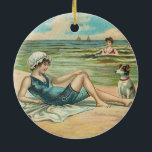 Ornement Rond En Céramique Victorian Beach Swim Girl Ocean Summer Vacances<br><div class="desc">Au Beach - Pour un doux thème côtier à l'ancienne,  cette carte postale victorienne,  avec une fille et son chien,  est en train de farnienter au bord de l'eau.</div>