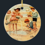 Ornement Rond En Céramique Vintage Antique Beach Boy Girl Enfants Art<br><div class="desc">At the Beach - Une ancienne gravure d'art de la plage victorienne jouant dans le sable. Une oeuvre d'art en bord de mer.</div>