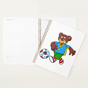 Ours de soccer jouant au football en tenue sportiv