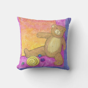 ours en peluche sur coussin violet