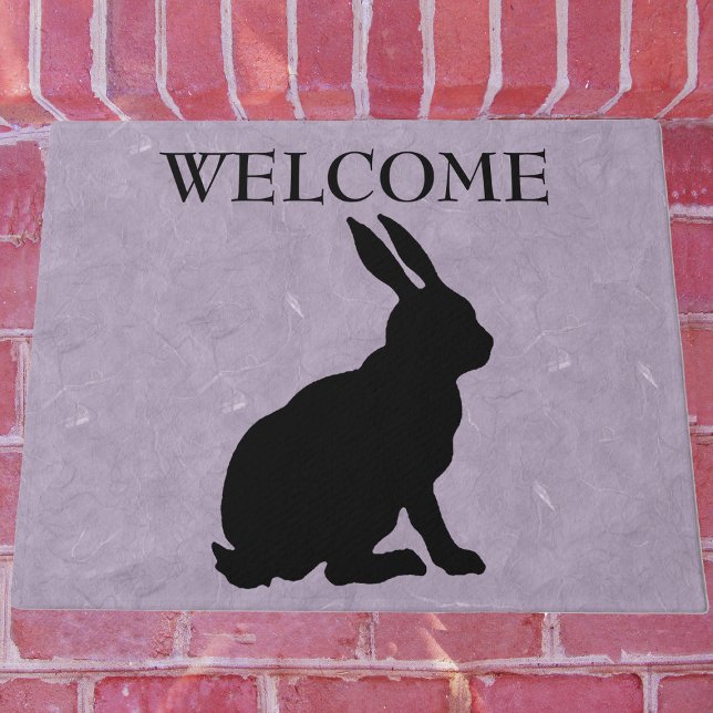 Paillasson Lapin Noir Assis Silhouette Marbré violet (Black side profile sitting silhouette for bunny rabbit on marbled purple Welcome outdoor mat.)