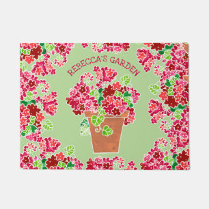 Paillasson Nom décoré d'un monogramme floral de géraniums