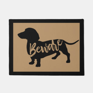 Paillasson Prenez garde de la silhouette noire de Doxie de