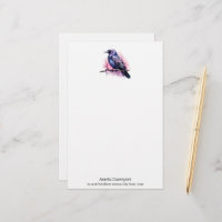 Un Corbeau noir sur une branche