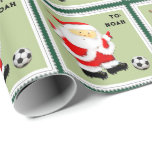 Papier Cadeau Baby Boy First Christmas Soccer Wrapper Paper<br><div class="desc">Design de Noël de football avec le Père Noël mignon en train de donner un coup de pied. Modifier le texte pour ajouter le nom.</div>