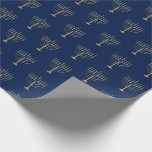 Papier Cadeau Bleu de motif de Hanoukka Menorah d'or de Faux<br><div class="desc">Enveloppez vos cadeaux dans le style cette saison des vacances avec notre enveloppe de cadeau élégante de Hanoukka. Ces caractéristiques de conception simples mais chics qu'un arrière - plan de bleu marine avec des menorahs d'or de faux a répétées dans un motif. Conçu par le © Tim Coffey et Susan...</div>