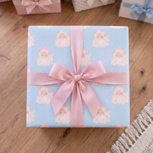 Papier cadeau bleu de Noël avec Père Noël rose vin