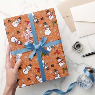 Papier Cadeau Bonhommes de neige et flocons de neige sur orange