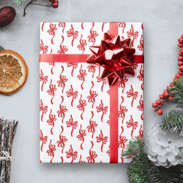 Papier Cadeau Bouopie illustrée rouge annonce le Motif de Noël (white Christmas holiday gift wrapping paper with a pattern of red looping bows)