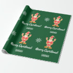 Papier Cadeau Christmas Gingerbread Brown Père Noël Personnalise<br><div class="desc">Enveloppe cadeau de Noël moderne pour les enfants,  avec un design minimaliste qui comprend une figure en pain d'épices de Père Noël,  des flocons de neige,  le salut "Joyeux Noël" dans la typographie stylisée,  et un nom personnalisé. Sur un arrière - plan vert de Noël.</div>