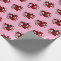 Papier cadeau cœur rouge sur fond rose amour