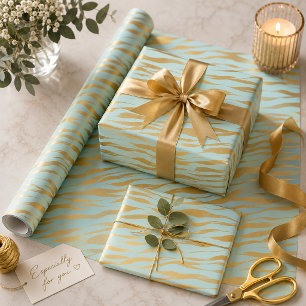 Papier Cadeau De jolies bandes dorées sur un fond bleu