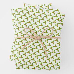 Papier cadeau de Noël main levée avec houx et baie