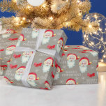 Papier Cadeau Jolly Santa Claus Vintage Christmas<br><div class="desc">Ce papier d'emballage cadeau de Noël présente un graphique classique du Père Noël sur un arrière - plan gris taupe. Le design est accentué avec des arcs rouges et des flocons de neige et le texte blanc "Joyeux Noël".</div>