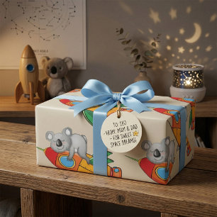 Papier Cadeau Koala dormant sur une fusée colorée