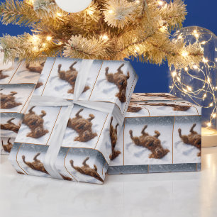Papier Cadeau L'Irish Setter de Noël faisant un ange de neige