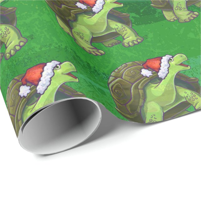 Papier Cadeau Tortue dans le casquette de Père Noël sur le vert (Coin rond)