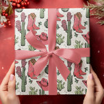 Papier Cadeau Western Howdy Christmas Cowgirl<br><div class="desc">Ce papier d'emballage Western Howdy Christmas Cowgirl amusant et festif présente des illustrations dessinées à la main de bottes de cowgirl de Noël,  de casquettes,  mitaines,  cactus,  baies saintes et étoiles. Le tout contre un élégant arrière - plan en ivoire.</div>
