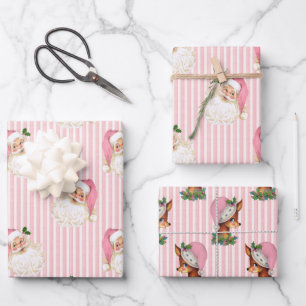 Papier d'enveloppement rose Père Noël et rennes vi