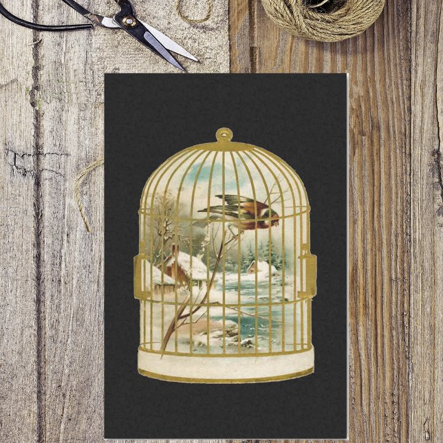 Papier Mousseline Golden Vintage Bird Cage Winter Scène (Golden birdcage with bird overlooking winter cabin in woods scene on black tissue paper for gifts.)