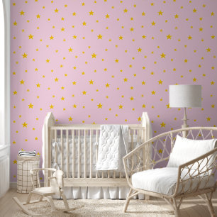 Papier Peint Étoiles dorées éparpillées sur rose clair