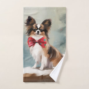 Papillon Chien dans la neige de Noël