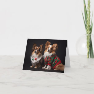 Papillon Chiens dans la carte de pulls de Noël