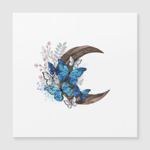 Papillons bleus sur croissant en bois