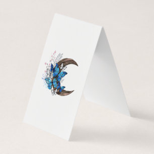 Papillons bleus sur croissant en bois