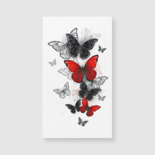 Papillons noirs et rouges volants