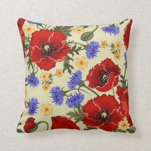 pavot rouge vintage et coussin bleu de fleurs