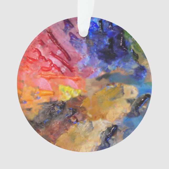 Peinture colorée de la palette du peintre artiste (devant)