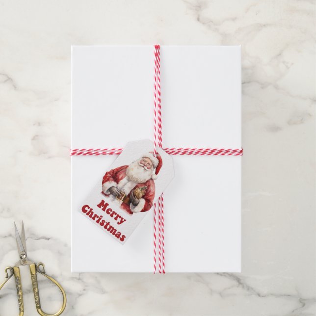 Père Noël avec cadeau sur étiquette de charme (Avec de la ficelle)