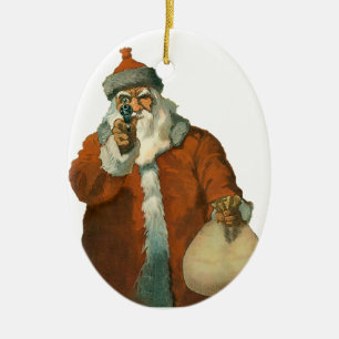 père Noël avec un ornement de Noël d'armes à f