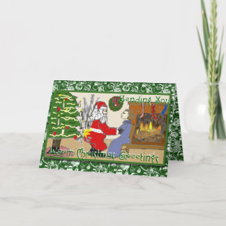 Père Noël drôle sur la carte de Noël du feu