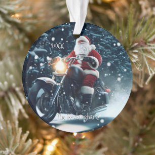 Père Noël sur une moto dans la neige