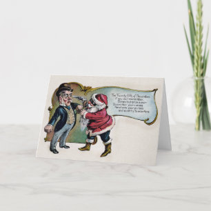 Père Noël vintage avec une carte de Noël à pistole