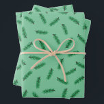 Petit pin bouge le papier d'emballage de Noël<br><div class="desc">Papier d'emballage de Noël avec boucles de pin vert sur un arrière - plan vert clair.</div>