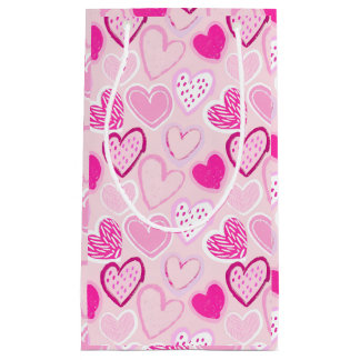 Petit Sac Cadeau Cœur motif à motif rose et magenta de teinte roman