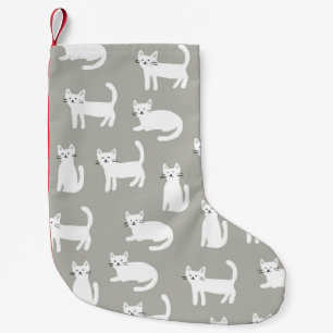 Petite Chaussette De Noël Chats mignons sans couture motif, design ludique.
