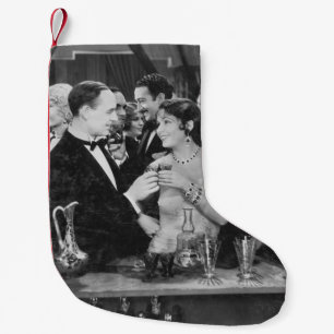 Petite Chaussette De Noël Couple à boire au bar bondé