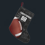 Petite Chaussette De Noël Football américain Personalized Chalkboard<br><div class="desc">Un design moderne en métal en grille de football américain avec un football sur un arrière - plan de typographie de tableau noir avec terminologie de football en arrière - plan. Le design comprend du texte personnalisable pour le nom et le numéro du joueur de football ou du ventilateur en...</div>
