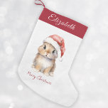 Petite Chaussette De Noël Lapin en Père Noël Rouge Casquette Personnalisé<br><div class="desc">Boutique de lapin de Noël Père Noël personnalisée, parfait pour vos petits en cette période de vacances. Cet adorable bas présente un mignon petit lapin portant un casquette Père Noël rouge recouvert de neige. Le stockage peut être personnalisé avec le nom de votre enfant. Accrochez-le sur votre manteau ou dans...</div>
