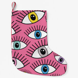 Petite Chaussette De Noël Motif magique aux yeux colorés. Contexte mystique