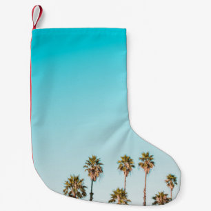 PETITE CHAUSSETTE DE NOËL PALMIERS VERTS ET BROWN SOUS UN CIEL BLEU CLAIR