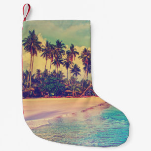 Petite Chaussette De Noël Paradis tropical : mer, hôtel, plage.