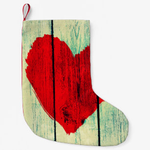 Petite Chaussette De Noël Symbole d'amour sur mur en bois