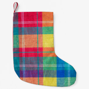 Petite Chaussette De Noël texture plaid en tissu coloré. Arrière - plan de t